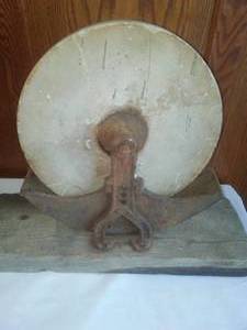 lot 213A image: Vintage Grinding Stone on frame.