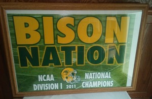 lot 118 image: BISON NATION 2011 National Champions framed poster