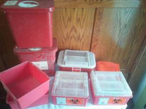lot 141 image: Biohazard sharps containers.