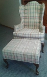 lot 175 image: Wing back side chair and ottoman.