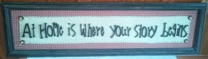 lot 179 image: At Home is where your story begins sign. (35 x 10.)