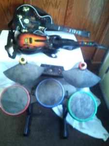 lot 194 image: Guitar Hero. 2 Guitars and drum set.