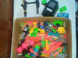 lot 233 image: GI Joe shooting attachment and bombs and vehicles and more.