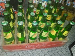 lot 259 image: Wood Coca Cola Coke case and 24 mellow yellow bottles.