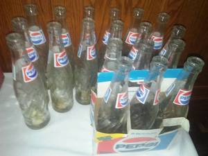 lot 261 image: Pepsi cola bottles and 6 pack, cardboard.