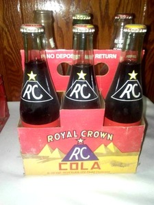 lot 262 image: Royal crown vintage six pack carrier and three bottles.
