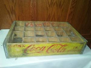 lot 264 image: Coca Cola wood crate in bottles  Yellow.