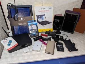 lot 100 image: Power Banks, Cases, Readers, Wireless Router and More