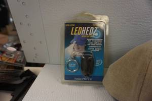 lot 86 image: Cobra Baseball Cap With Lead Hedz Cap Light and PSE Speed Kills DVD