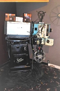 Movie reel projector