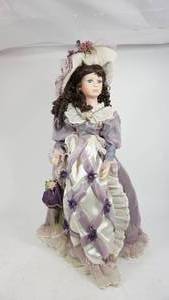 lot 39 image: Partial Porcelain Doll W A Beautiful Lavender & White Long Dress & Hat