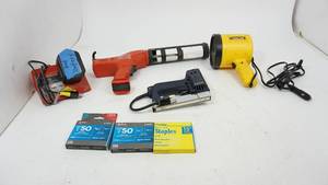 lot 47 image: Vector 12 Volt Sport Spotlight--Heavy Duty Staples--Milwaukee Heavy Duty Battery Operated Calking & Adhesive Gun--Milwaukee Battery Charger--Arrow 115 VAC Stapler