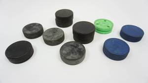 lot 62 image: Ten Hockey Pucks
