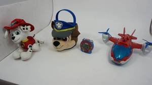 lot 132 image: Red, White, & Blue Plastic Airplane--Nickelodeon 2018 Spinmaster Plush Bucket--Nickelodeon Paw Patrol Plush Dog--Paw Patrol Alarm Clock