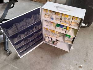lot 13 image: First Aid Kit full of supplies 15 5.522.25 Top corner damage, see photos