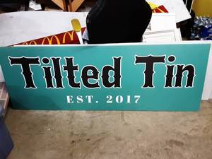 lot 11 image: Tilted Tin Sign 74x26