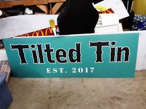 lot 12 image: Tilted Tin Sign 74x26