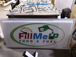 lot 22 image: Fill Me Up Food & Fuel Sign 36x72