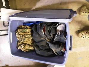 lot 55 image: Tote Bin Full Of Winter Clothes