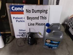 lot 57 image: 2-Jugs Of Anti-Freeze, Signs & Partial Spool Of Wire
