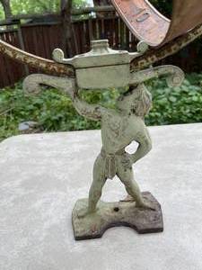 lot 405 image: Vintage Boy Holding Sphere Patio Art