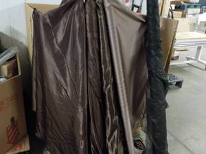 Brown and Black Rolls of Fabric man...