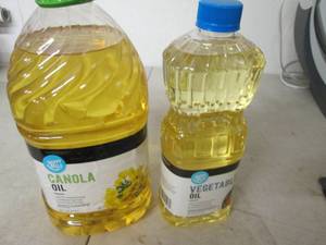 lot 165 image: 1 gallon of canola oil and 48 oz of...