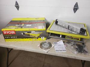 lot 28 image: Ryobi 7 inch Wet Tile Saw