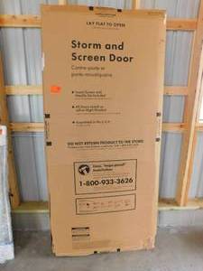 lot 78 image: 36 in. x 80 in. K900 Series White Vinyl Self-Storing Pet Storm Door with Black Hardware by EMCO