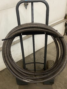 lot 7 image: Milwaukee 1000# Dolly With Sewer Snake Cables