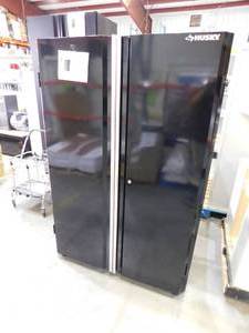 lot 90 image: Ready-to-Assemble 24-Gauge Steel Freestanding Garage Cabinet in Black (48 in. W x 72 in. H x 18 in. D) by Husky