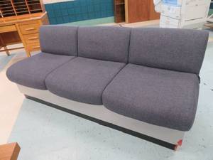 lot 64 image: Sleek Blue Couch