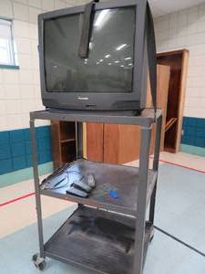 lot 69 image: Metal rolling cart with TV