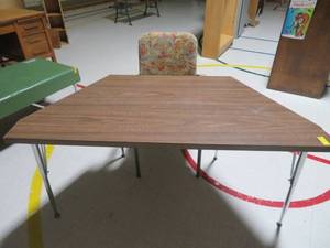lot 132 image: brown wooden table and floral chair
