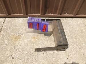 Lawn tractor weight with mounting bracket. As shown.