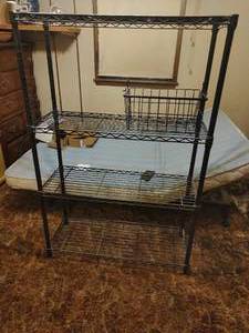 Black metal shelf and closet hanging