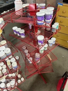 Collection Of Assorted Paints With Stands