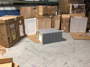 Pallet of assorted Hampton Bay Cabinets (customer returns, various sizes and colors) conditions unknown
