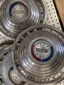 lot 57 image: Lot of Four Ford 1960s Galaxie 500 Hubcaps
