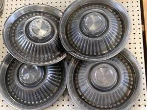 lot 59 image: Lot of Four Pontiac Motor Division Hubcaps Late 1950s Early 60s