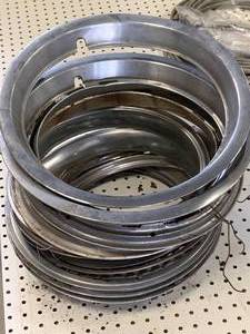 lot 62 image: Large Lot of Hubcap Frame Trim