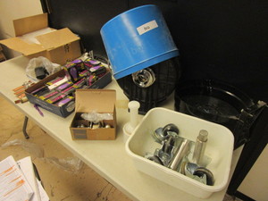 lot 844 image: BLACK LIGHTBULBS, CLEAR PLASTIC BAGS, SCHLAGE DOOR KNOB, SHOP TOWEL DISPENSER, CASTERS, MORE