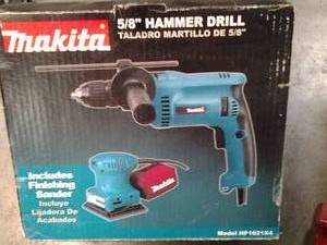 lot 54 image: Makita Electric 58 Hammer Drill a...