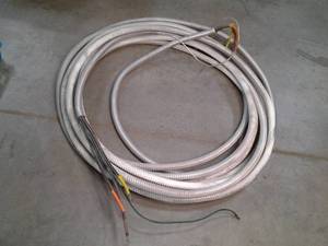 lot 63 image: Large Roll of Conduit (appears to b...