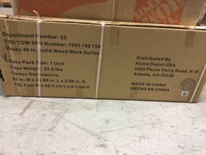 lot 81 image: Husky 48 in. Solid Wood Work Surface for Regular Duty Welded Steel Garage Storage System not used