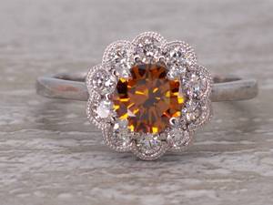 lot 4 image: .78 Carat Fancy Orange GIA Certified Diamond with White Floral Halo in 14k Gold