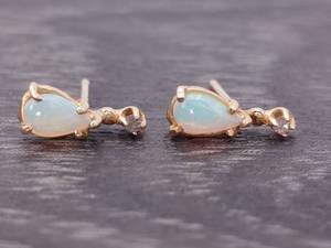 lot 47 image: Glowing Tear Drop Opal and Diamond Earrings in 14k Gold