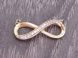 lot 48 image: Horizontal Infinity Diamond Pendant in Yellow Gold