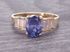 lot 51 image: Oval Blue Gemstone and Cubic Zirconium Estate Ring in 14k Gold