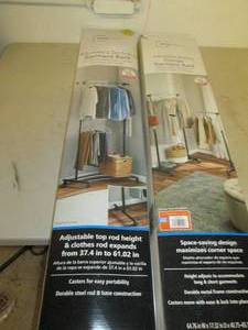 lot 34 image: 2- tier rolling garment rack and a ...